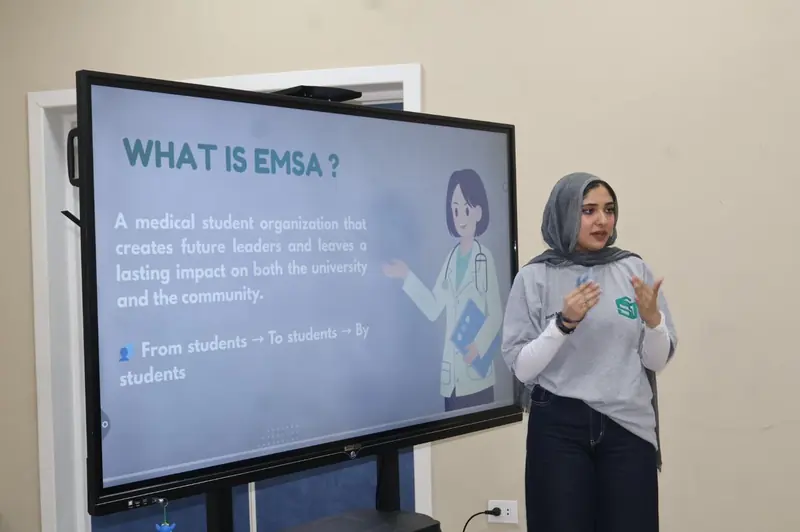 A member presents a "What is EMSA?" slide: a medical student organization, from students, to students, by students