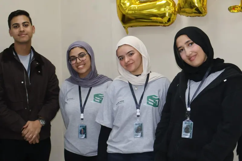 Four members wearing EMSA-BUC uniforms and lanyards